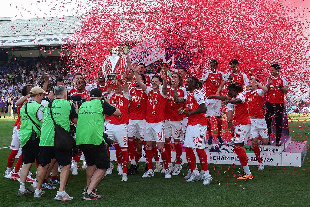 Arsenal players celebrating with the Premier League trophy