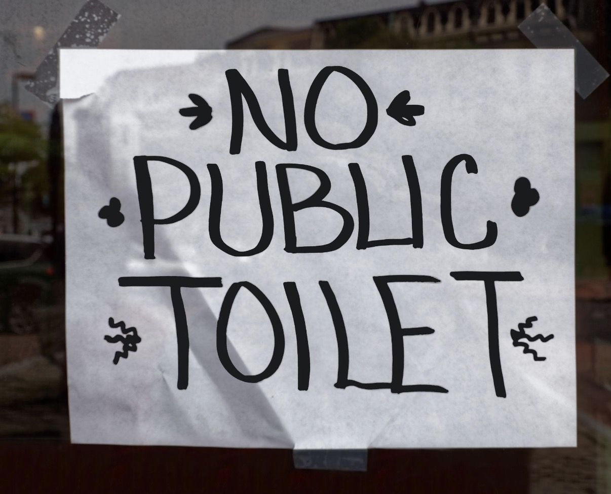 Handwritten sign reading No Public Toilet