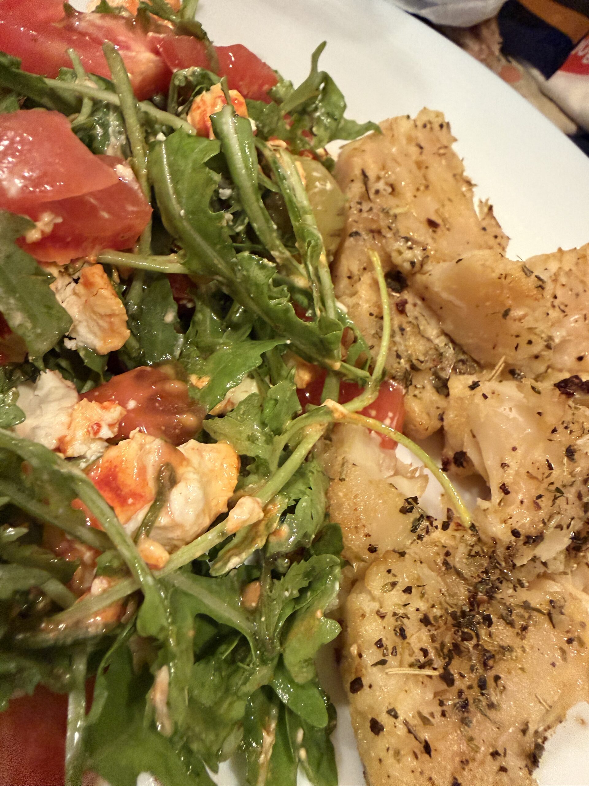 Roasted cauliflower with rocket, tomatoes, goat's cheese, olives and chili oil