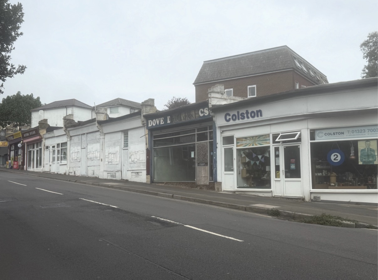 Independent businesses still trade here. The street around them is thinning out.