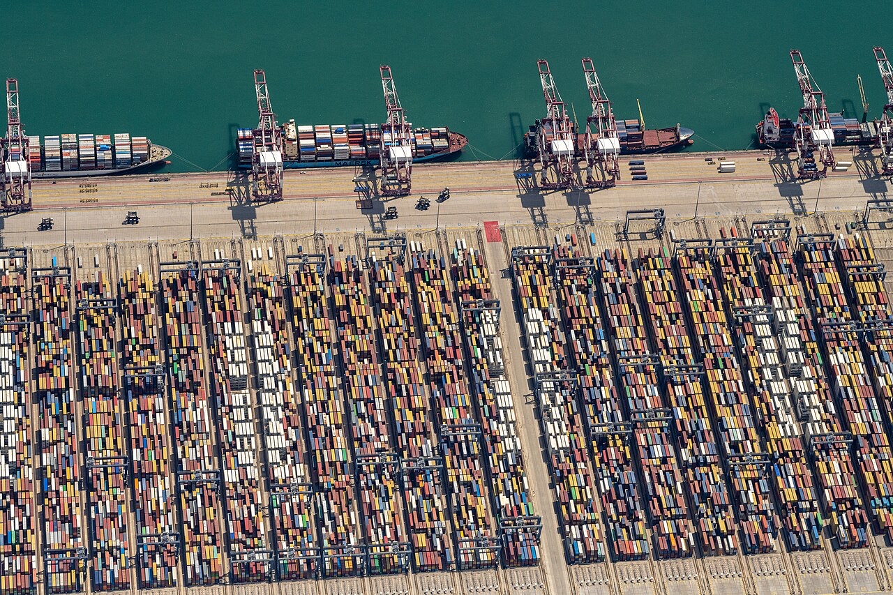 A vast container port showing the physical infrastructure required to reach global markets