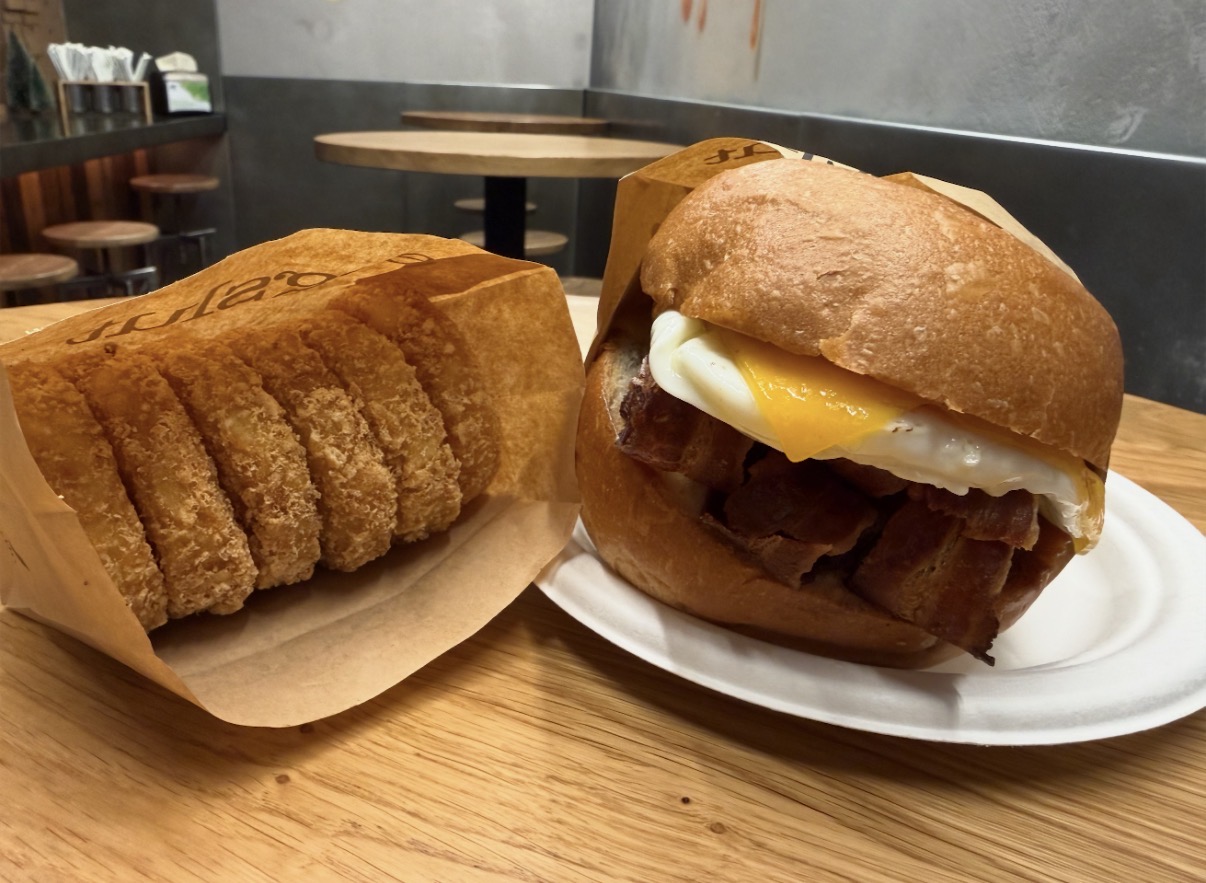 Eggslut bacon, egg and cheese sandwich with hash browns and coffee near Liverpool Street