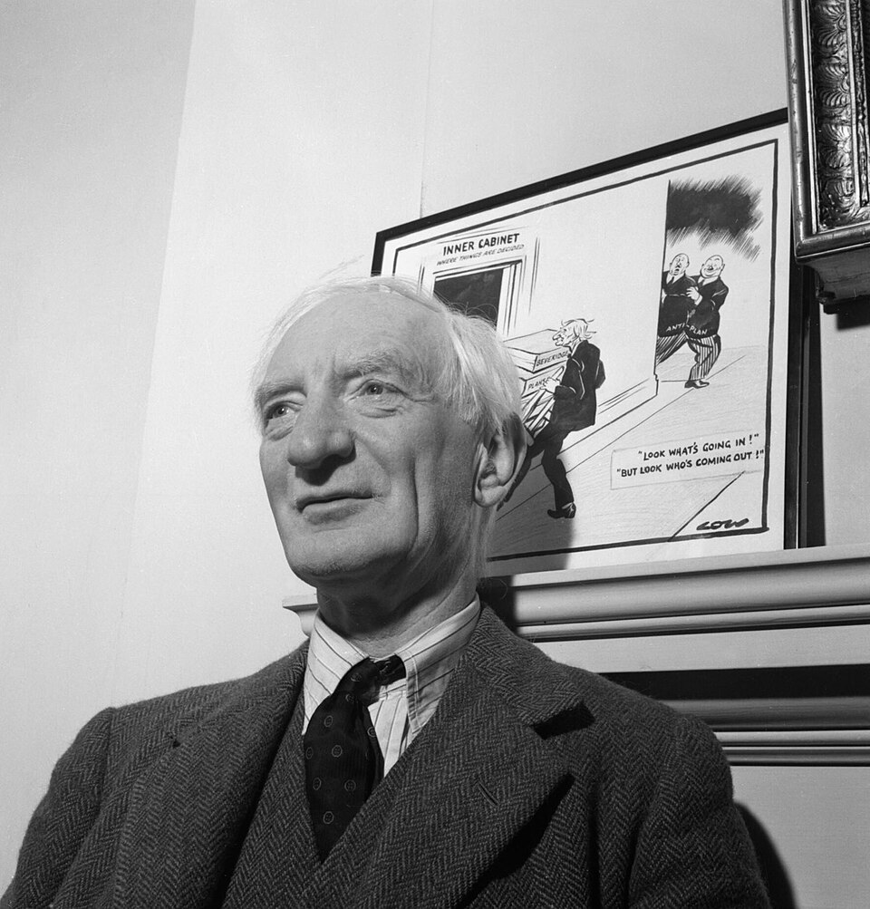 Sir William Beveridge in his study at University College Oxford in 1943