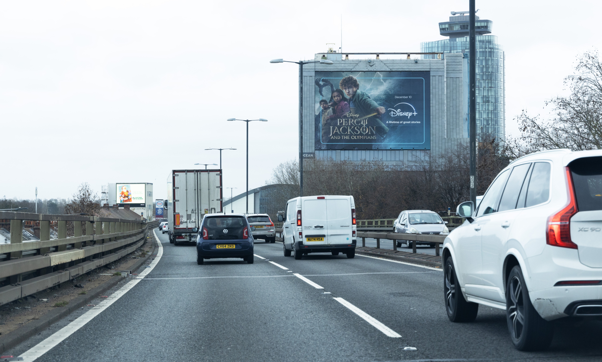 Alfa Laval Tower beside the M4 carrying a Disneyland Paris advertisement reading Where Magic Gets Real