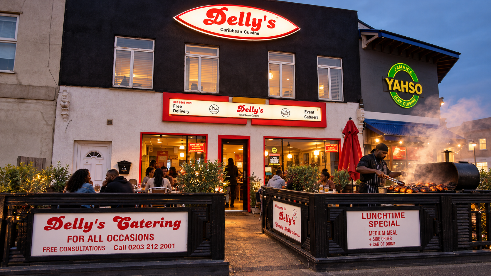 Reconstruction of the former Delly’s restaurant with a cook tending a jerk smoker inside the terrace beside Yahso