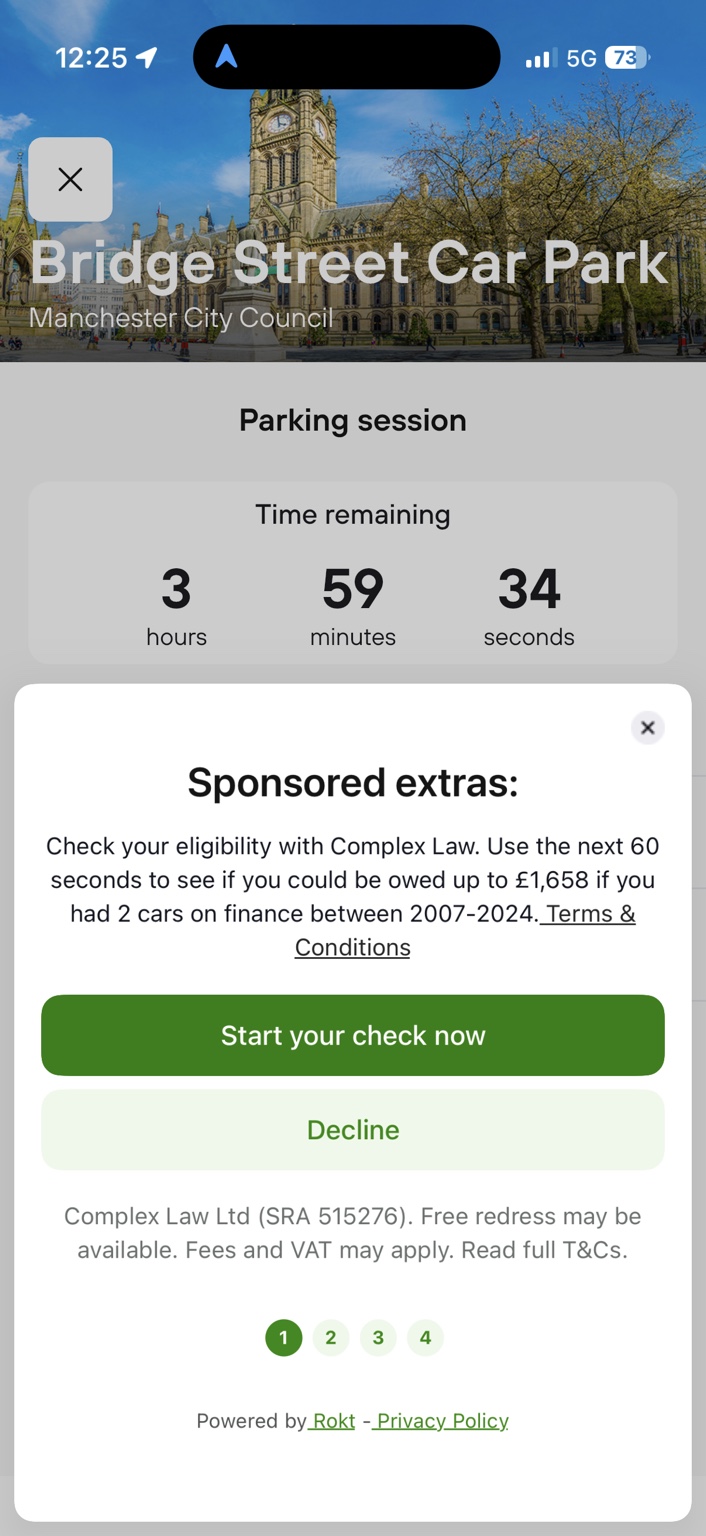 Manchester parking confirmation showing nearly four hours remaining with a sponsored advert displayed on the screen.
