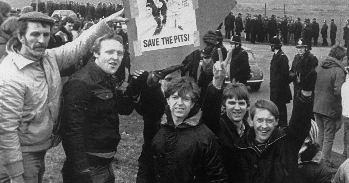 Children and families during the 1984–85 miners’ strike with a Save the Pits placard
